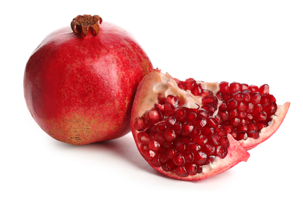 Ripe pomegranates on white background. Delicious fruits - Valokuva, kuva