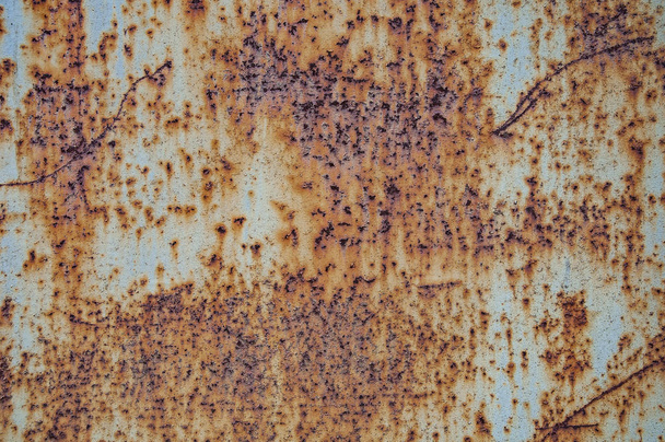 Rust. Texture and background of old rusty metal sheet. Rusty iron, with scratches and paint residue. - Photo, Image