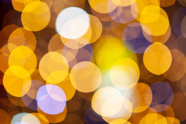 Gold glittering christmas lights. Blurred abstract background, close-up - Zdjęcie, obraz