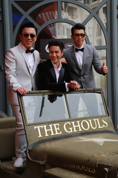(From left) Chinese actors Huang Bo, Chen Kun and Xia Yu pose at a photocall for their movie "The Ghouls" during the 68th Cannes Film Festival in Cannes, France, 14 May 2015. - Foto, Imagem