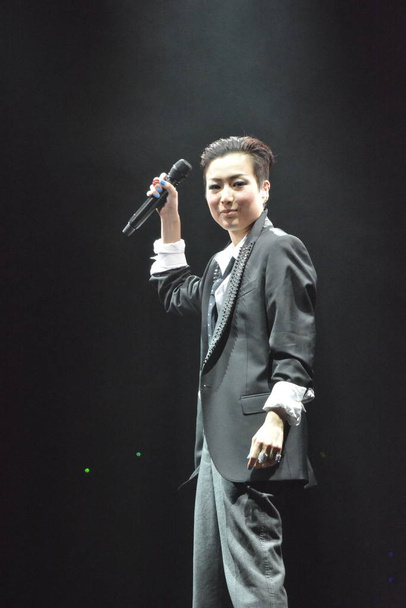 Hong Kong singer Sammi Cheng performs at singer-songwriter Eddie Ng's concert in Hong Kong, China, 6 April 2015. - Zdjęcie, obraz