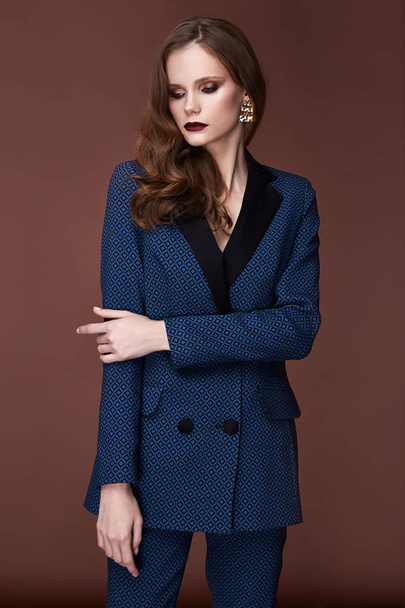 Beautiful sexy young business woman dark hair evening makeup wearing formal suit jacket pants high heels shoes business clothes for meetings walks autumn spring collection perfect body shape make-up. - Fotografie, Obrázek