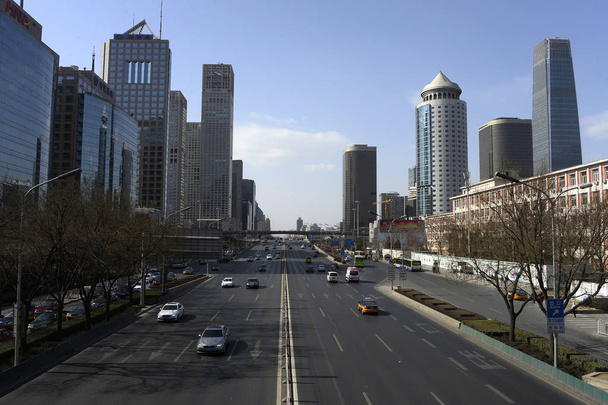 View of an almost empty street at CBD (Central Business District) before the upcoming Chinese Lunar New Year or the Spring Festival in Beijing, China, 16 February 2015 - Fotoğraf, Görsel