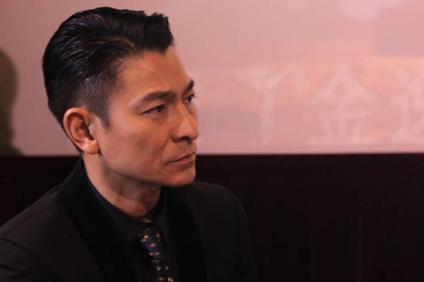 Hong Kong actor Andy Lau attends a press conference for his new movie "Lost and Love" in Xiamen city, southeast Chinas Fujian province, 19 March 2015.     - Foto, Imagem