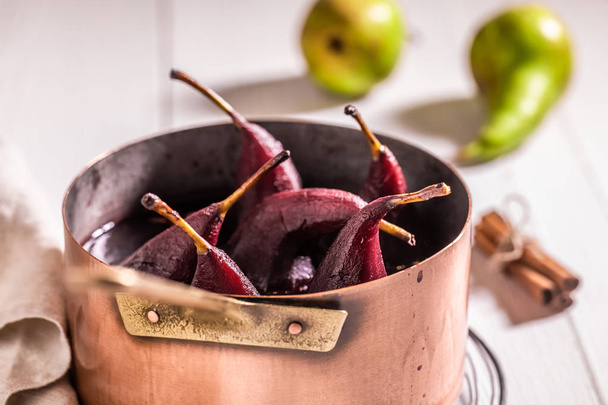 Delicious mulled wine with pears on white table - Φωτογραφία, εικόνα
