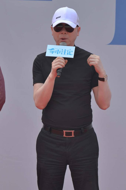 Chinese director Feng Xiaogang speaks during a press conference for his movie "Fated" in Beijing, China, 28 April 2015. - Фото, изображение