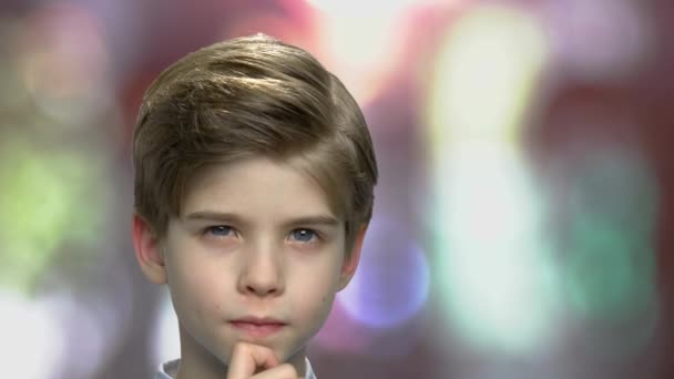 Serious little boy with thoughtful expression. - Footage, Video