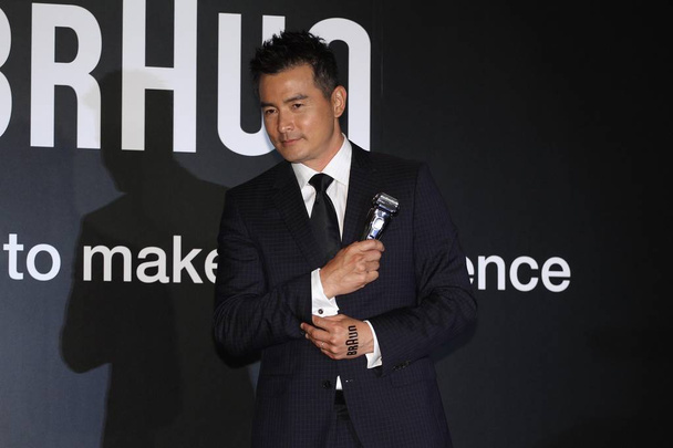 Singaporean actor Christopher Lee Ming-shun poses at a promotional event for Braun electric shaver in Taipei, Taiwan, 16 June 2015. - Photo, image