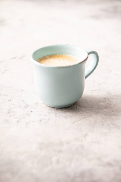 A cup of coffee on light grey background, coffee break concept - Zdjęcie, obraz