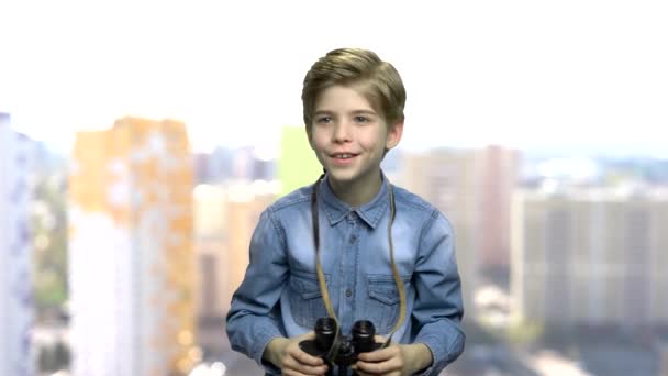 Excited preteen boy using binoculars. - Footage, Video