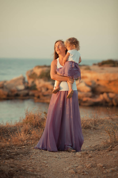 portrait of Happy nice Mother and small daughter near sea - Foto, immagini