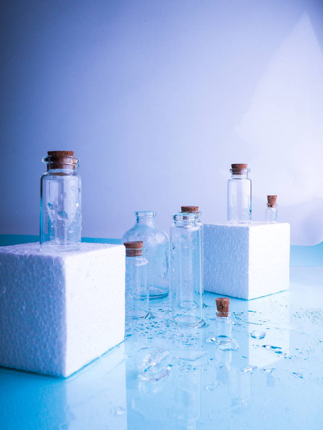 Few transparent bottles, water sprays. empty glass bottles - Photo, Image