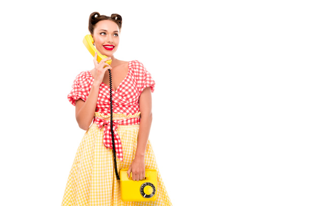 Tyylikäs pin up tyttö puhuu vintage keltainen puhelin
 - Valokuva, kuva
