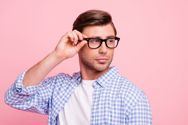 Close up photo of beautiful amazing brunet he him his handsome arm on specs not trust lies doubt unsure wearing casual checkered plaid shirt outfit isolated on rose background - Фото, зображення