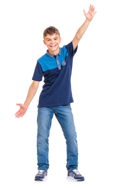Full length portrait of young caucasian teen boy isolated on white background. Funny teenager showing something by hands. Handsome child looking at camera and smiling. - Foto, Bild