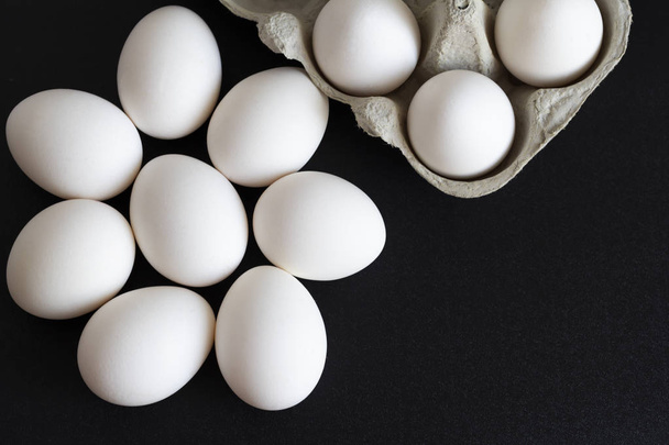 chicken eggs in a cardboard tray on background - Photo, Image