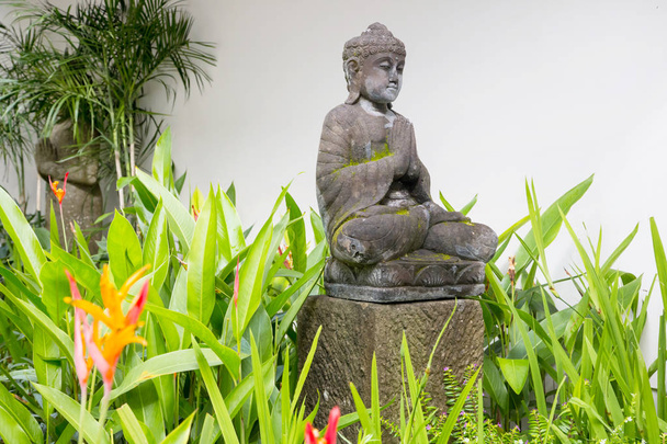 Traditional Balinese statue in the garden - Photo, Image
