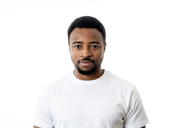 Portrait of attractive, confident african american young man looking neutral relaxed and serious in facial expressions, human emotions, Success and education concept. Isolated on grey background. - Фото, зображення