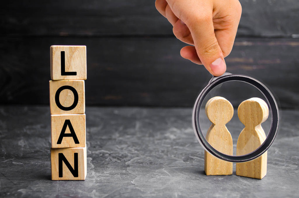 The concept of "Loan". Businessmen are discussing questions about the company's loans. The financial loans between the lender and the borrower. Secured and mortgage loan. Refinement interest rates - Valokuva, kuva
