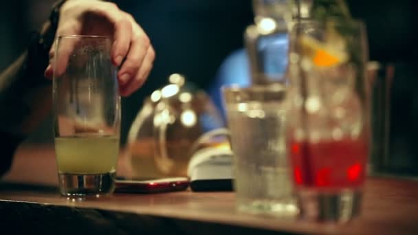 Pub. A person takes an alcoholic cocktail from the bar counter - Footage, Video