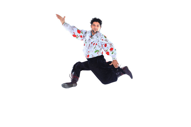 Gypsy male dancer in traditional dress performs folk dance - Photo, image