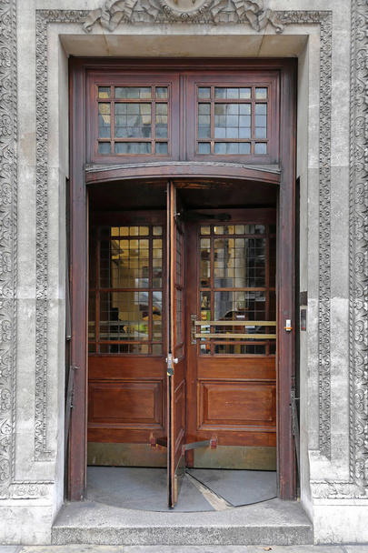 Wooden Revolving Door at Old Bank Building - 写真・画像