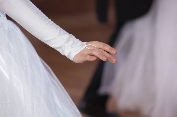 Wedding theme, holding hands newlyweds White gloves Close-up - Фото, зображення
