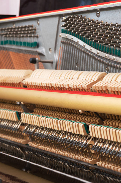 Close-up view of hammers and strings inside the piano. - Photo, Image
