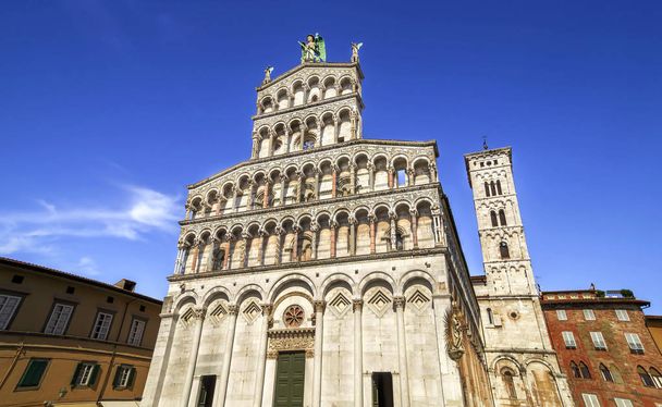 LUCCA, ITALY - JUNE 26, 2015. Chiesa di San Michele in Foro - Church of San Michele in Foro,catholic church dedicated to Archangel Michael, beautiful attraction in the ancient city of Lucca, Italy.  - Фото, изображение