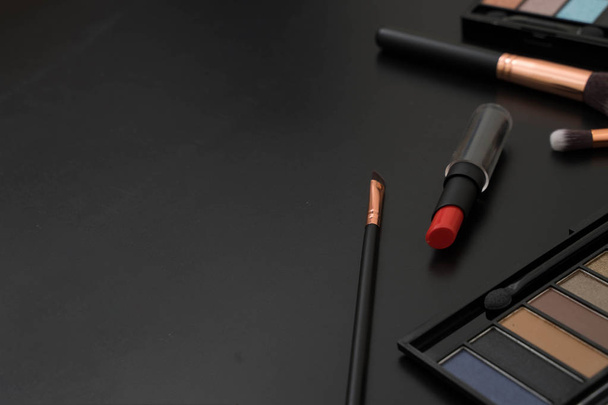 make up  and brushes  on black background - Фото, изображение