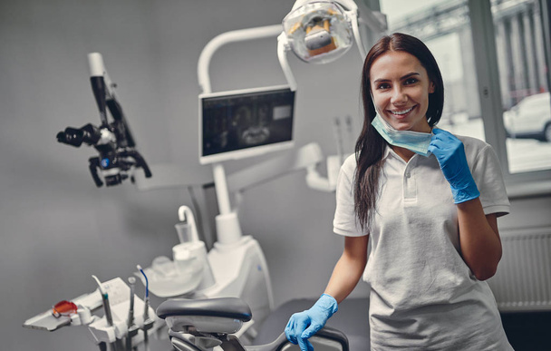 Female dentist is working in modern stomatology clinic. - Zdjęcie, obraz