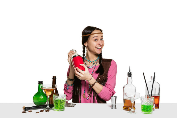 Expert female barman is making cocktail at studio - Photo, image