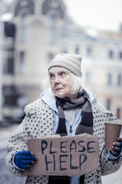 Depressed senior woman begging on the street - Foto, Imagem