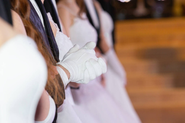 Wedding theme, holding hands newlyweds White gloves Close-up - 写真・画像