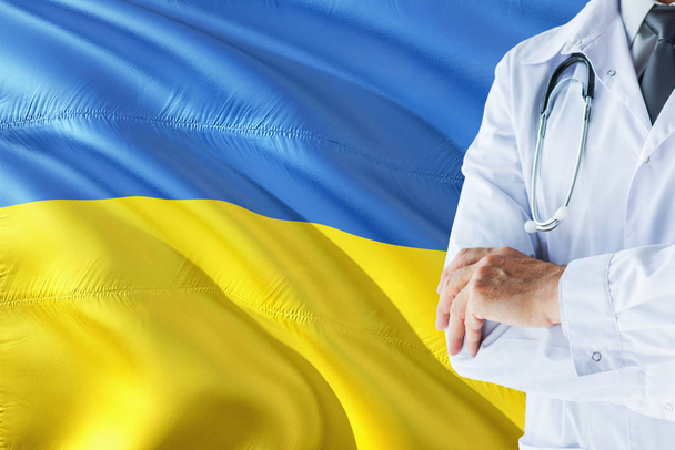 Ukrainian Doctor standing with stethoscope on Ukraine flag background. National healthcare system concept, medical theme. - Fotó, kép