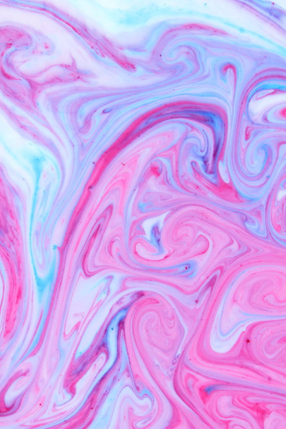 Abstract multicolored background. Fluid art of pink blue. Blue pink texture. Colored paint stains in liquid - Фото, зображення