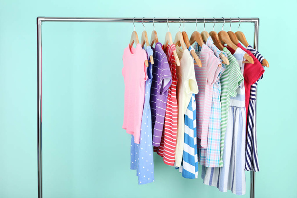 Clothes hanging on mint background - Foto, imagen