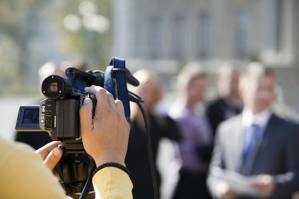 covering an event with a video camera - Photo, Image