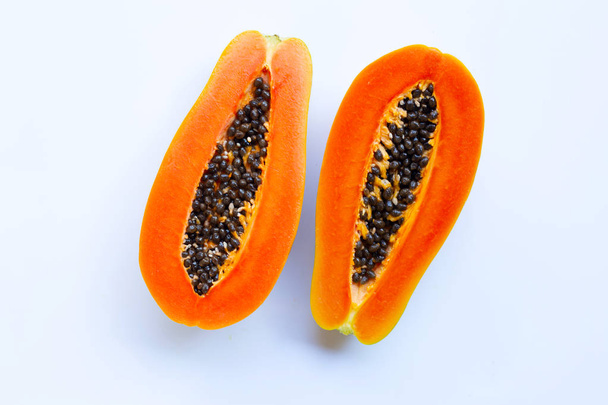 Half of ripe papaya fruit with seeds isolated on white background - Photo, Image