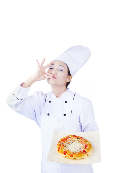 Asian chef serve delicious pizza on white - Foto, afbeelding