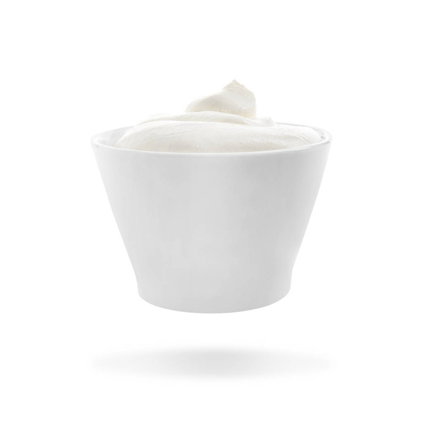 Ceramic bowl with delicious sour cream on white background - Foto, Imagem
