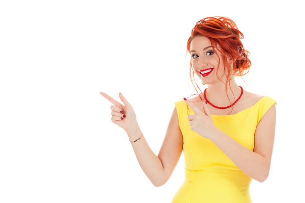 Happy beautiful young woman showing pointing to the side with fingers isolated on white studio background. Look right here hands gesture, surprised face expression and body language, positive emotions - Photo, image