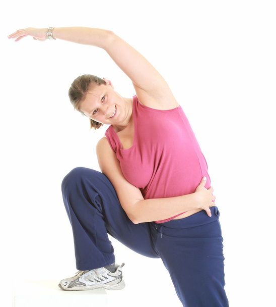 Fit woman stretching isolated over a whi - Фото, зображення
