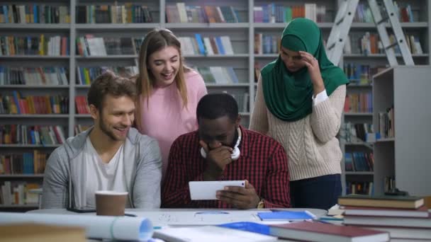 Diverse students browsing funny content on tablet - Footage, Video