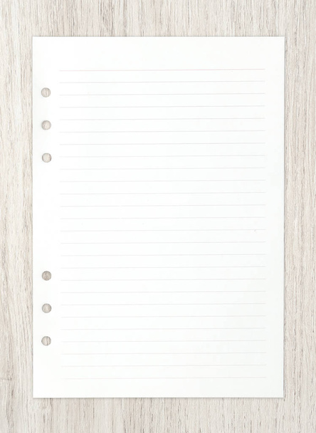 White paper sheet on wood for business background. - Фото, зображення
