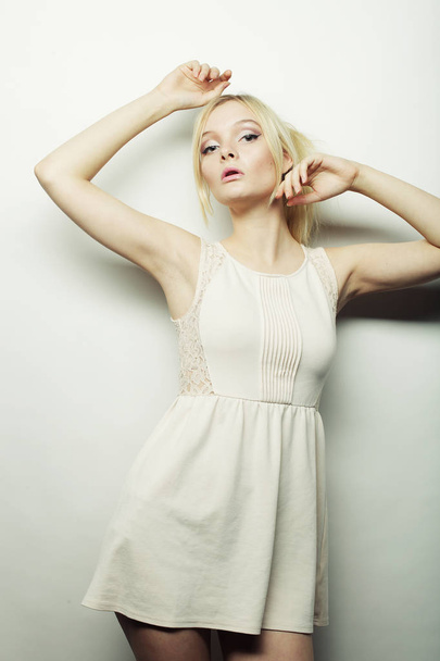 fashion blond woman in white dress posing in studio - Photo, image