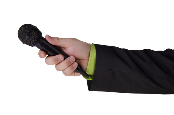 Man's hand holding a microphone - Photo, Image