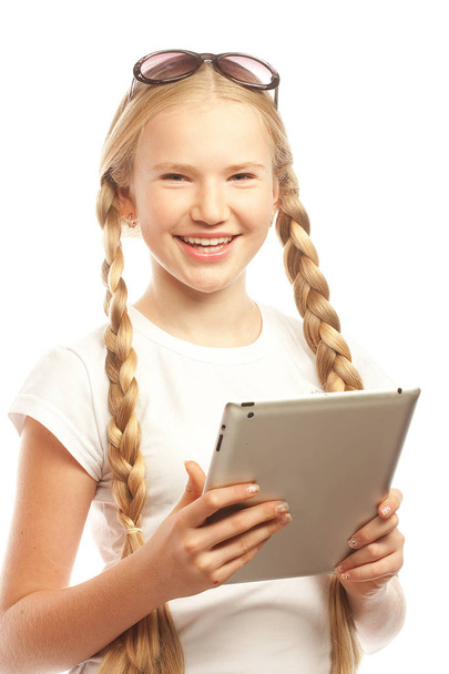Pretty little girl with a Tablet PC  - Foto, Imagen