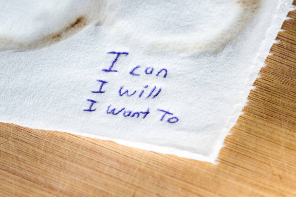 hand written note on a coffee stained napkin with an empowering message, I can I will I want to. - Photo, Image