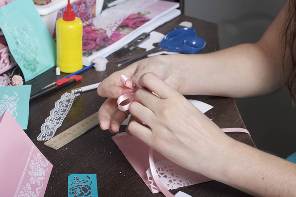 Making greeting cards from paper, cardboard and tape. Female artisan working with tape. - Foto, afbeelding